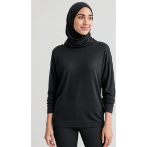 A black women's batwing sweater top, featuring a relaxed fit and long sleeves, worn with a matching headscarf.