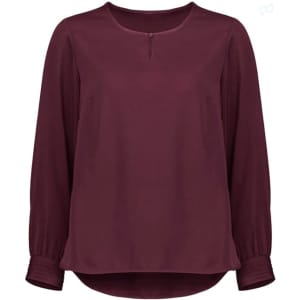 A burgundy long sleeve blouse with a round neckline and button detail, featuring gathered sleeves and a flowing silhouette.