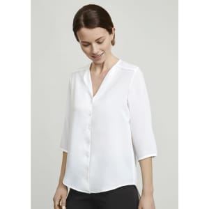 A white women's longline blouse with a button-up front and three-quarter sleeves, featuring a subtle sheen.