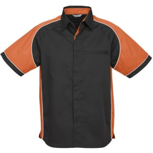 A black short sleeve button-up shirt with orange accents and piping, featuring a chest pocket and a logo.