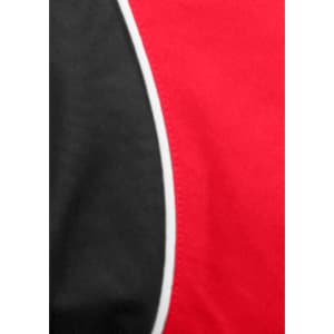A close-up of a red and black short sleeve shirt with contrasting piping details and a logo.