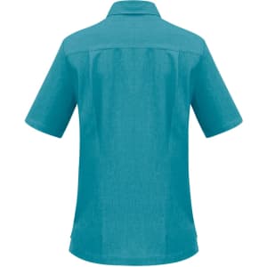 A turquoise women's overblouse with short sleeves and a collar, featuring a logo on the back.