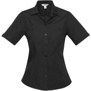 A black women's button-up shirt featuring short sleeves and two chest pockets. It has a fitted shape and a logo.