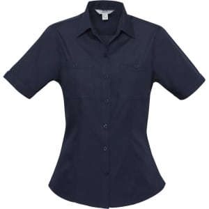 A navy blue women's button-up shirt with short sleeves and two front pockets. It features a logo on the label.