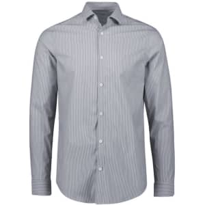 A tailored long sleeve shirt in navy blue with a striped pattern and a logo on the chest.