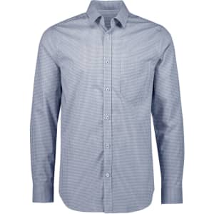 A men's long sleeve button-up shirt in a classic check pattern, featuring shades of blue and white. The shirt has a logo.