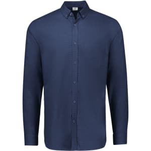 A navy long sleeve button-up shirt with a collar and a single chest pocket. It features a logo on the label.