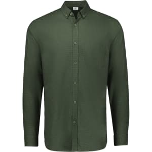 A long-sleeve, button-up shirt in a rich olive green colour with a chest pocket and a collar. Features a logo.