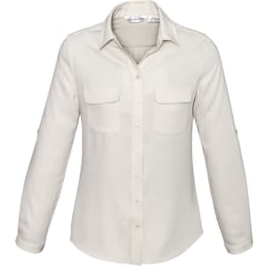 A women's button-up shirt in cream, featuring a collar and two front pockets. The shirt has long sleeves.