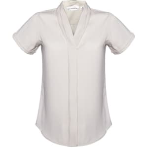 A short-sleeve women's button-up shirt in a light cream colour, featuring a v-neck design and rolled sleeves.