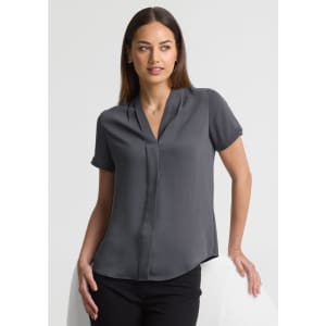 A short-sleeve, button-up shirt in grey, featuring a collared neckline, displayed on a model against a neutral background.