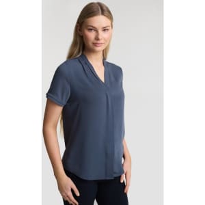 A women's button-up shirt in a navy blue colour with short sleeves and a v-neck design. It features a logo.