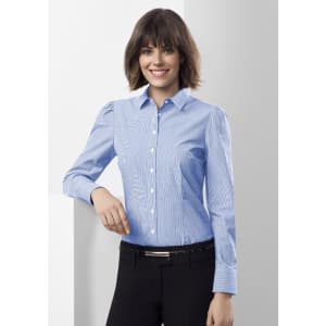 A women's long sleeve button-up shirt in light blue with vertical stripes, featuring a collar and fitted silhouette.