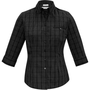 A black and white checked women's button-up shirt with 3/4 sleeves and a pocket. It features a collar and a logo.