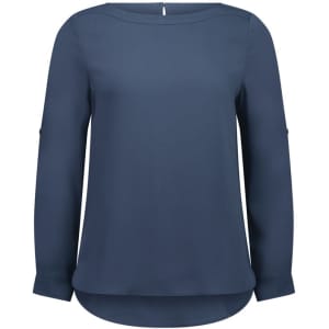 A navy blue boatneck top with long sleeves and a curved hem, featuring a subtle logo on the garment.