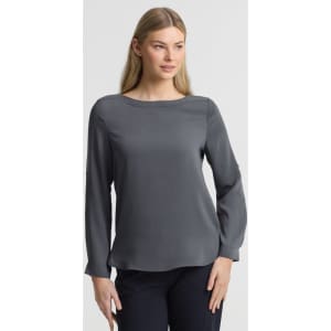 A grey women's boatneck top with long sleeves, featuring a simple design and a subtle branding element.