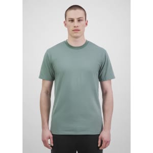 A green short sleeve tee displayed on a male model against a neutral background, featuring a logo.