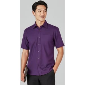 A plain short sleeve button-up shirt in purple, featuring a logo and a sleek, casual design.