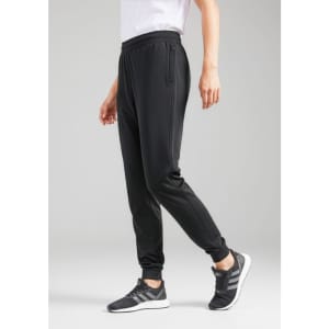 A pair of black track pants with a tapered fit, featuring convenient side pockets and an elastic waistband.