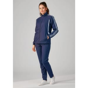 A model wearing navy unisex flash track pants with a matching jacket, featuring a logo and contrasting stripes.