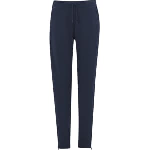 Navy women's track pants with a drawstring waist and a logo on the side. Features a slim fit and ankle zippers.
