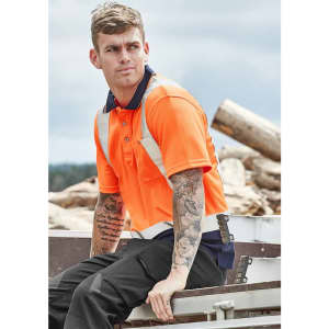 Hi-vis spliced short sleeve polo in bright orange with shoulder taping, worn by a man with tattoos.