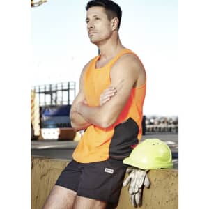A man wearing an orange high-visibility singlet stands beside a yellow hard hat and gloves.