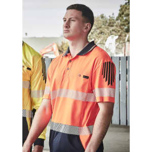 Men's short sleeve polo in high visibility orange with segmented reflective tape and a logo on the chest.