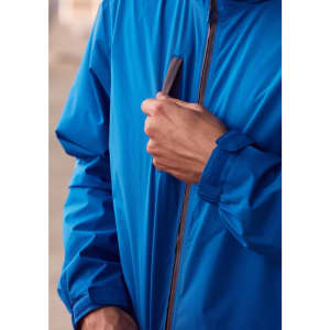 A blue unisex super light packable rain jacket with a zip and a logo on the chest.