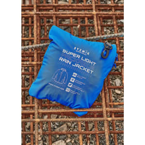 A blue packable rain jacket folded into a compact pouch with a logo and zipper.
