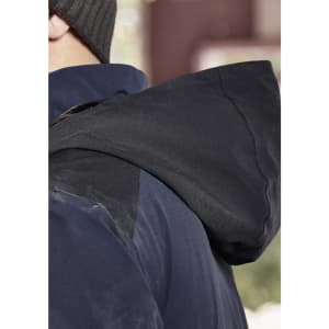 A waterproof jacket in navy blue with a dark hood, featuring a logo on the back.