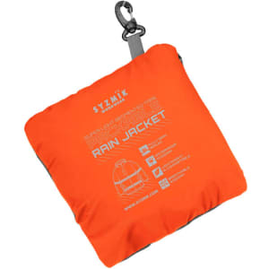 An orange packable rain jacket in a compact, square shape with a clip for attachment and a logo.