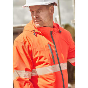 A bright orange unisex packable rain jacket with reflective stripes and a hood, worn by a man in a safety hat.