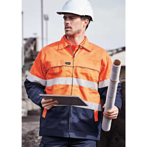 A man wearing a high-visibility orange and navy jacket, holding a notebook and rolled plans, with a hard hat on.