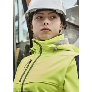 A women's bright yellow stretch softshell jacket with a hood, worn by a person in a hard hat.