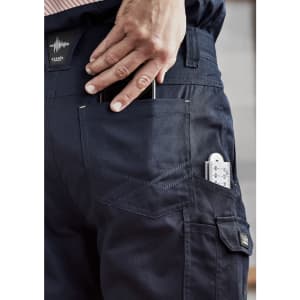 Navy cargo pants featuring multiple pockets, including a phone holder and a pocket for tools. Includes a branding logo.