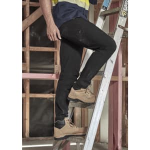 Mens lightweight outdoor cargo pants in black, worn by a person standing on a ladder, featuring a logo.