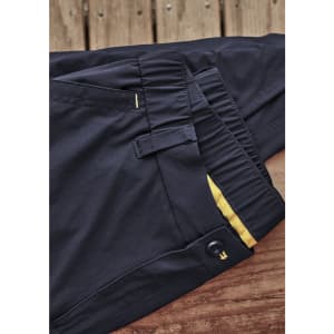 Lightweight men's outdoor cargo pants in black, featuring a button closure and elastic waistband, with a logo present.