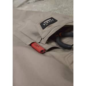 Rugged cooling stretch cargo pants in beige with a logo patch and tool loops.