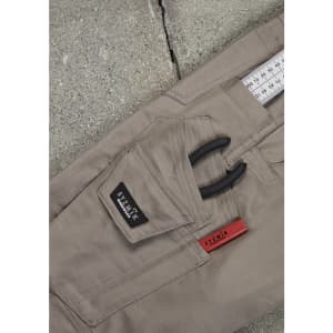 A pair of men's rugged cooling stretch cargo pants in khaki, featuring a pocket for tools and a logo.