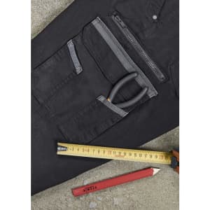 A black work pant featuring multiple pockets, measuring tape, a pencil, and a pair of pliers.