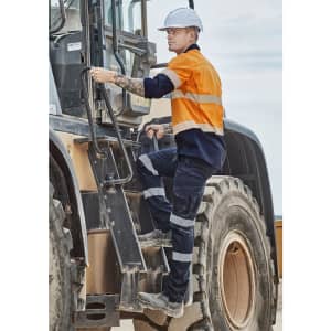 Men's rugged work pants in navy and orange, featuring reflective tape and a logo, worn by a worker climbing machinery.