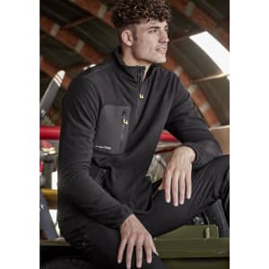 A unisex black lightweight 1/4 zip polar fleece featuring a front pocket and a logo. Suitable for workwear and outdoor use.