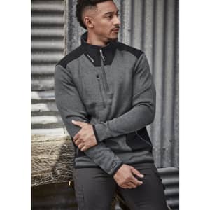 A grey and black unisex pullover with a 1/2 zip and a logo, set against a textured background.