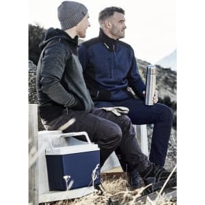 A unisex 1/2 zip pullover in navy and grey, worn by two men sitting outdoors with a drink bottle and a cooler.