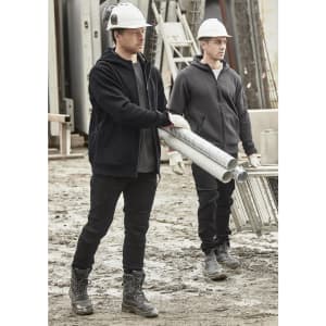 Unisex zip front multi-pocket hoodie in black, worn by two men on a construction site, carrying pipes. Both wear hard hats.