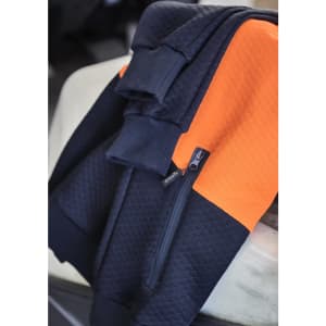 A textured jacquard hoodie featuring navy and orange colours, with a front zip pocket and a logo.