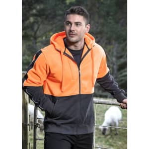 A unisex hi-vis full zip hoodie in bright orange and black, featuring a logo, worn by a model outdoors.