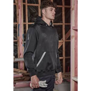 A unisex water-resistant hoodie in black, featuring a logo and pockets, worn by a model in a construction setting.