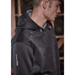 A black unisex water-resistant hoodie with a grey interior and a logo on the sleeve, worn by a man.